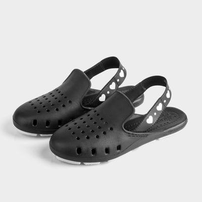 Womens and girls black water shoes. Foam shoes - Slingback black crocs with heart print on strap
